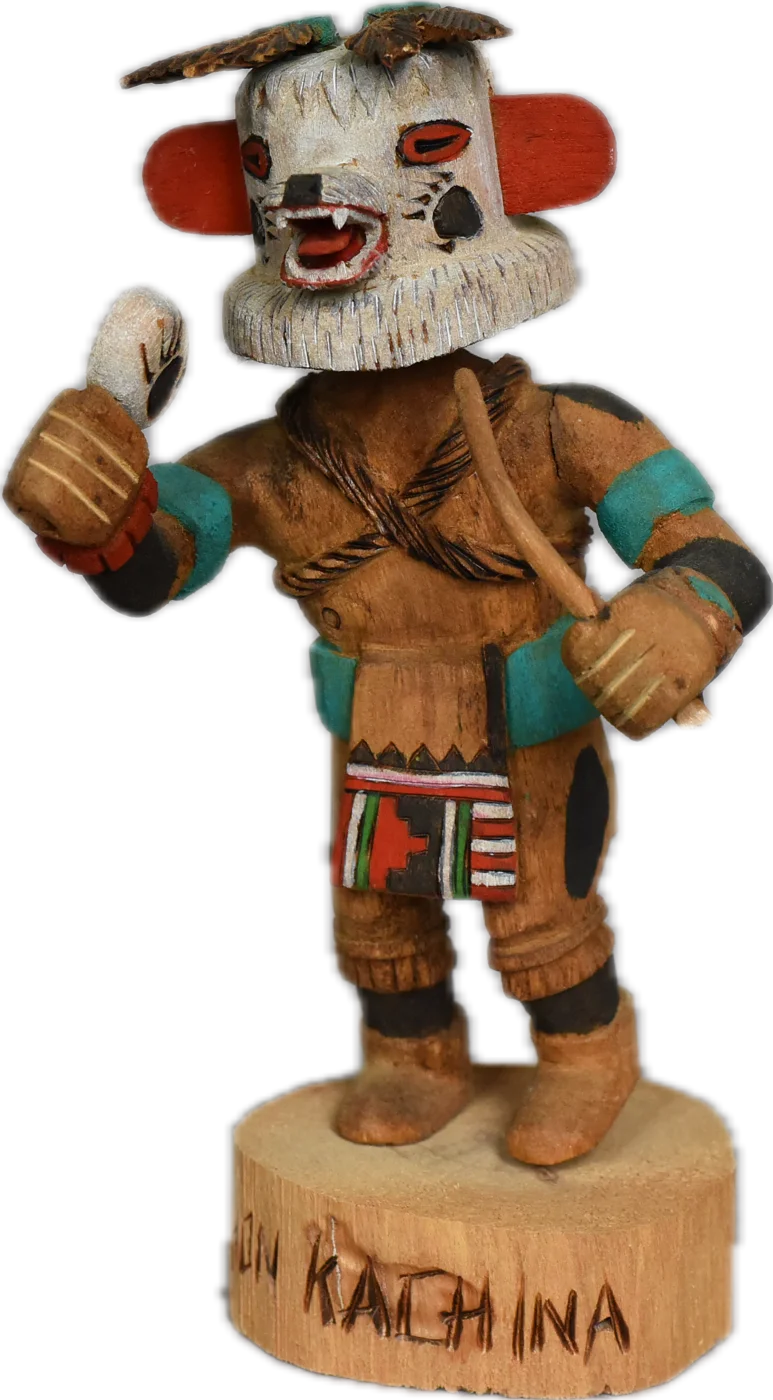 The kachina figure of Marafado — white masked face with red ears, standing with one hand raised